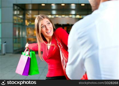 Woman wants to shop into mall, dragging her man or boyfriend to join