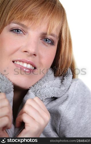 Woman warming up with her jacket