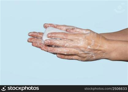 woman washing hands isolated blue 2