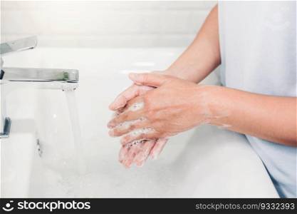 Woman Washing hands to prevent spread of CoronaVirus as well as cold, flu, bacteria at home