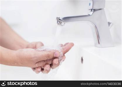 Woman washing hands With soap to protect against Corona virus or Covid 19