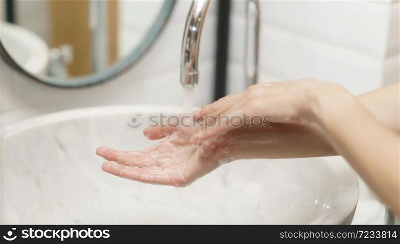 Woman washing her hands, focus finger