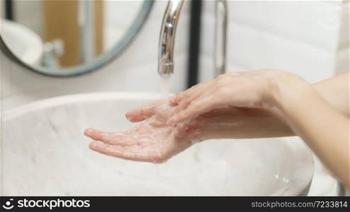 Woman washing her hands, focus finger