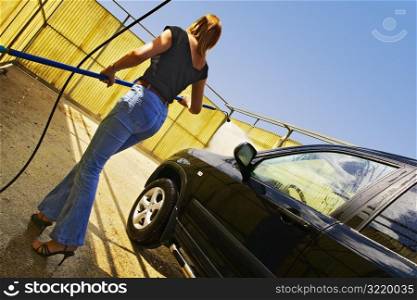 Woman Washing Her SUV