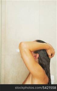 Woman washing in shower
