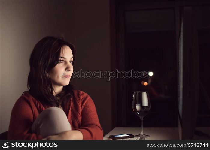 Woman watching online videos on desktop
