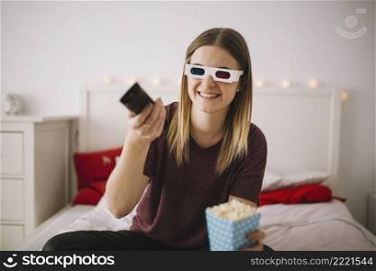 woman watching tv bed