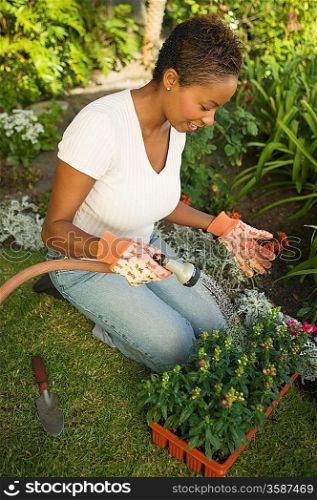 Woman Watering New Plants