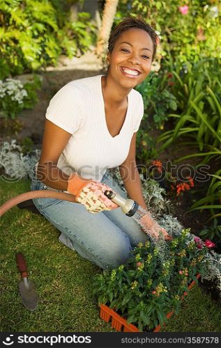 Woman Watering New Plants