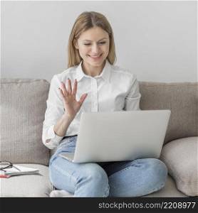 woman waving her class online