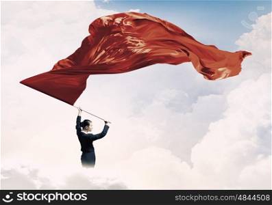Woman waving red flag. Determined businesswoman waving flag as symbol of women power