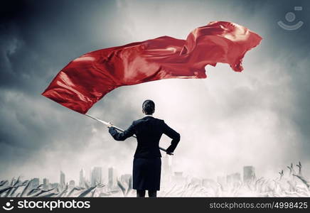 Woman waving red flag. Determined businesswoman waving flag as symbol of women power