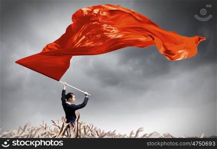 Woman waving red flag. Young determined businesswoman with red flag in hands