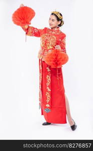 Woman wear Cheongsam suit show decorate red l&to her shop in chinese new year 