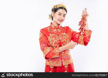 Woman wear Cheongsam suit smile to get Firecrackers from boss in chinese new year