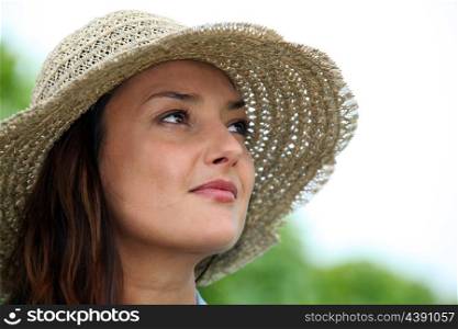Woman wearing a straw hat