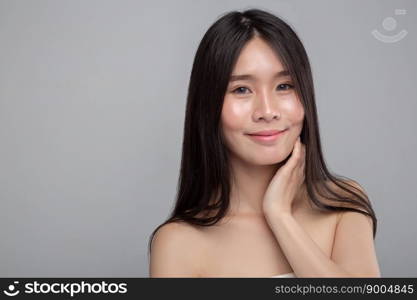 woman wearing a white strapless dress and hands touching the neck