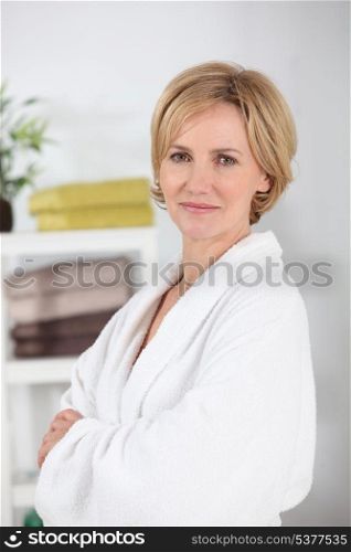 Woman wearing a white toweling bathrobe