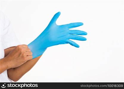 Woman wearing and putting hand to blue rubber latex glove for doctor, studio shot isolated on white background, Hospital medical safety concept