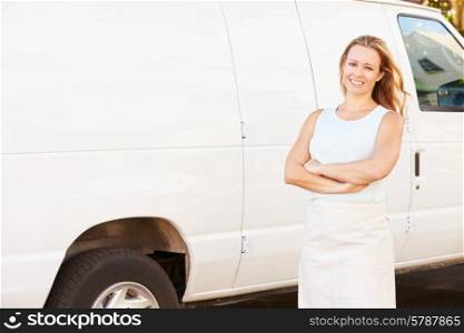 Woman Wearing Apron Standing In Front Of Van