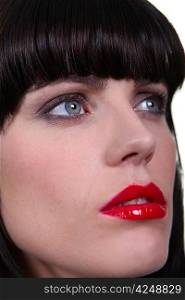 Woman wearing bright red lipstick