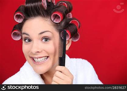 woman wearing curlers on the head