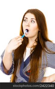 Woman wearing dressing gown brushing cleaning teeth. Funny girl with toothbrush. Oral hygiene. Isolated on white. Woman brushing cleaning teeth.