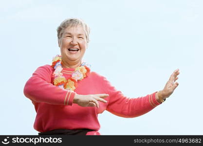 Woman wearing flower garland and dancing