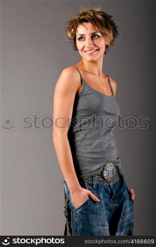 woman wearing gray tank top and jeans