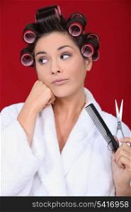 Woman wearing hair rollers