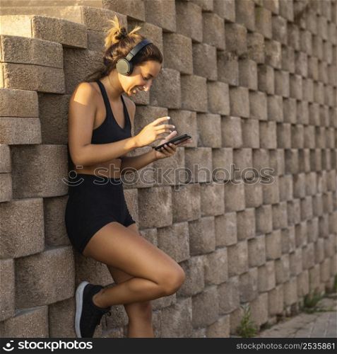 woman wearing headphones outdoors