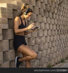 woman wearing headphones outdoors