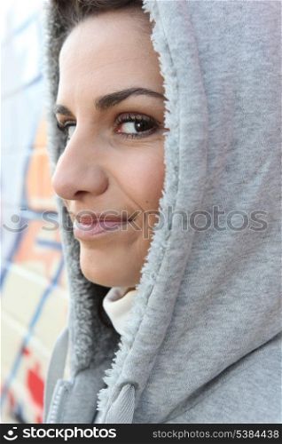 Woman wearing hooded sweater