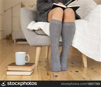 woman wearing knee socks sitting armchair. Resolution and high quality beautiful photo. woman wearing knee socks sitting armchair. High quality and resolution beautiful photo concept