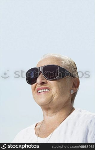 Woman wearing large sunglasses