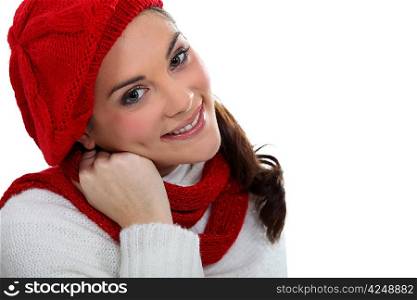 Woman wearing matching hat and scarf