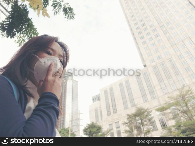 woman wearing protective mask in the city street, Bangkok thailand