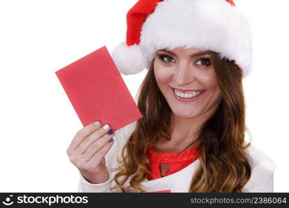 Woman wearing santa claus hat holding red envelope reading children letter or wish list. Positive face expression. Christmas time. Studio shot isolated on white. Woman in santa claus hat reading letter