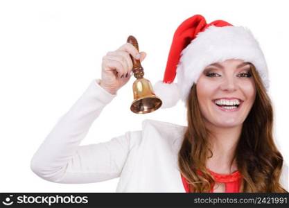Woman wearing santa claus hat ringing a bell. Happiness holidays Christmas time concept. Studio shot isolated on white. Woman in santa claus hat ringing a bell