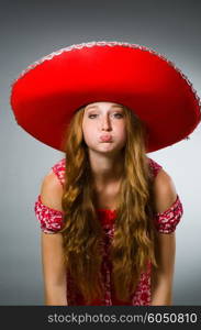 Woman wearing sombrero hat in funny concept