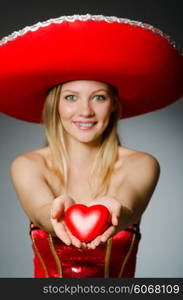 Woman wearing sombrero hat in funny concept