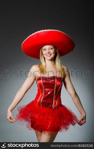 Woman wearing sombrero hat in funny concept