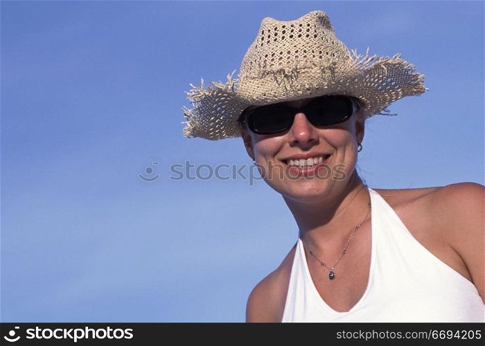 Woman Wearing Straw Hat and Sunglasses