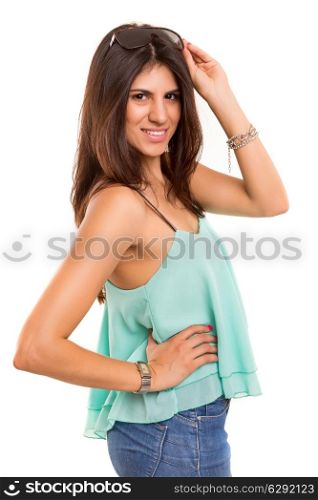 Woman wearing sunglasses and posing isolated over a copy space background