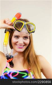 Woman wearing swimsuit with snorkeling mask having fun studio shot, Happy joyful girl dreaming about active summer vacation. Snorkeling swimming concept. Woman with snorkeling mask having fun