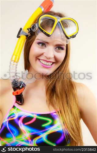 Woman wearing swimsuit with snorkeling mask having fun studio shot, Happy joyful girl dreaming about active summer vacation. Snorkeling swimming concept. Woman with snorkeling mask having fun