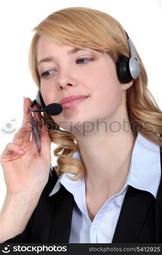 Woman wearing telephone head-set