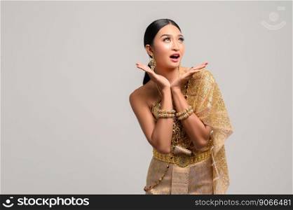 Woman wearing Thai dress as a symbol for wow hands