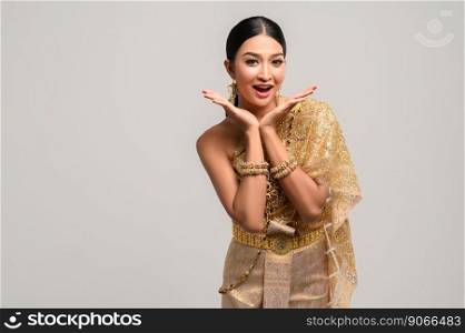 Woman wearing Thai dress as a symbol for wow hands