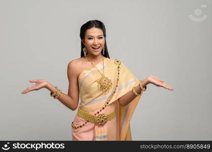 woman wearing Thai dress that made a hand symbol